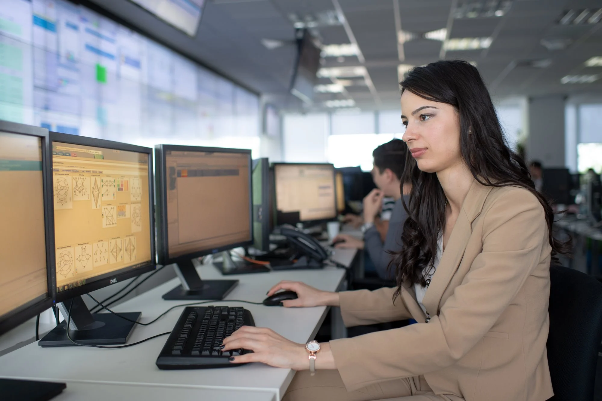 woman working with multiple screens