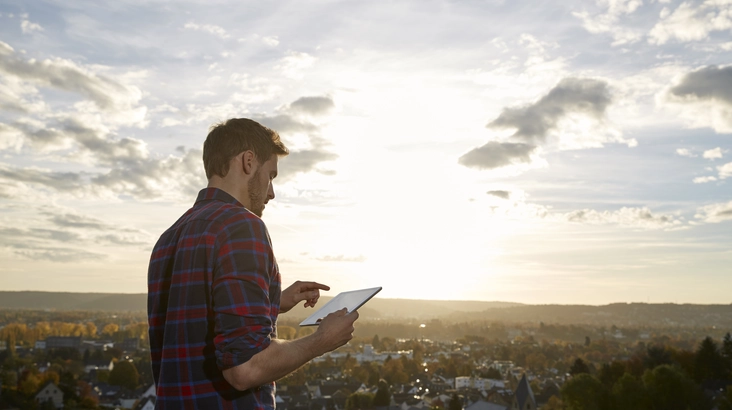 Man with a tablet outdoor