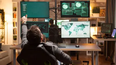 A person working in a high-tech control room or cybersecurity operations center, surrounded by multiple monitors displaying global maps, data, and security information.