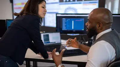 Two colleagues talking about work