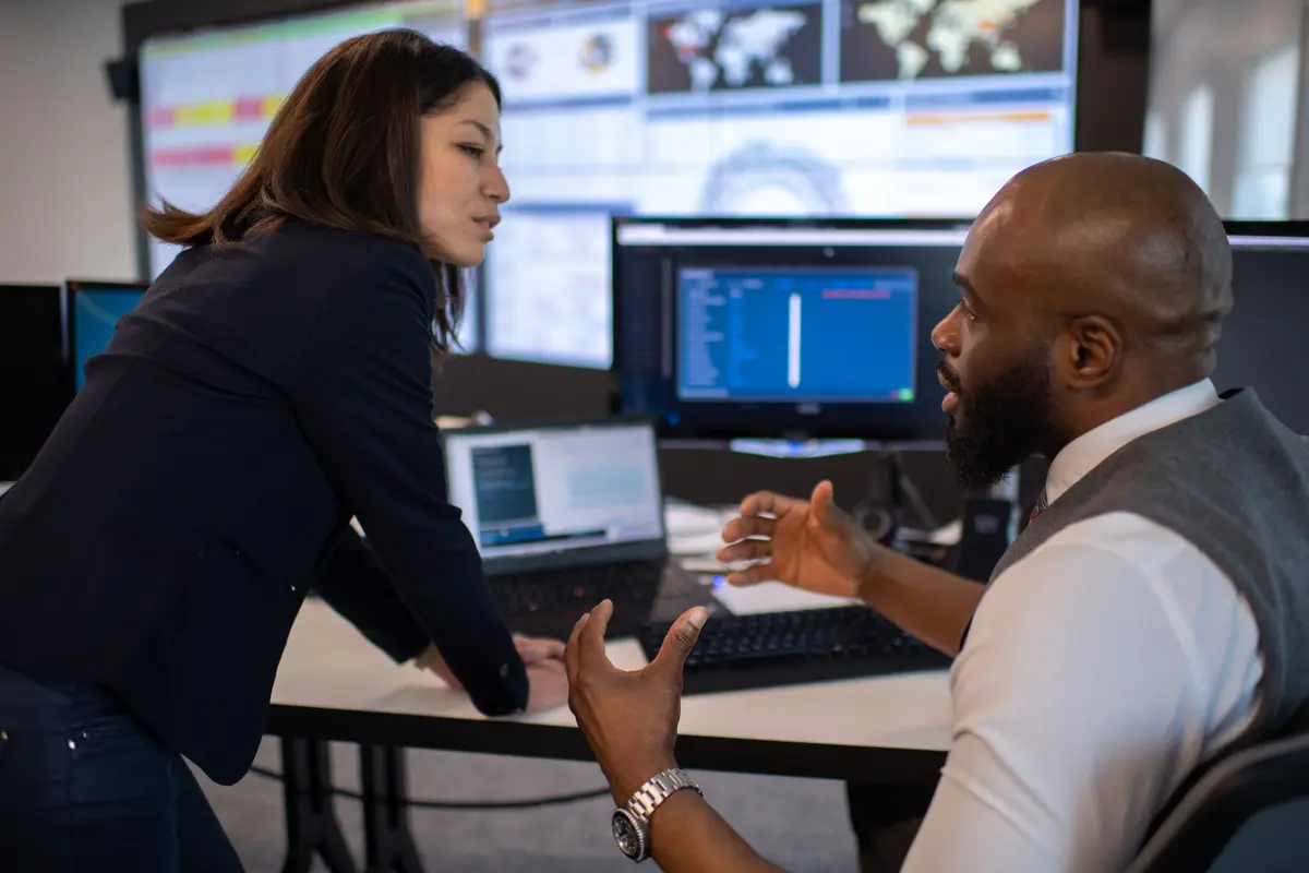 Two colleagues talking about work